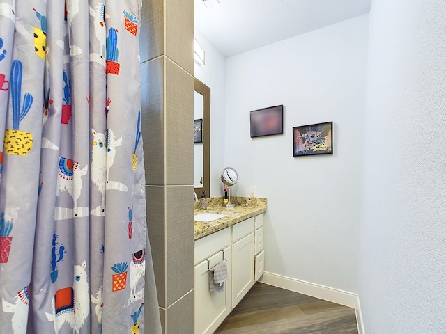 bathroom featuring wood-type flooring and vanity