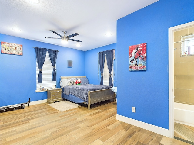 bedroom featuring light wood-type flooring and ceiling fan