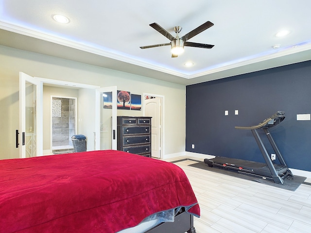 bedroom featuring light hardwood / wood-style flooring, ceiling fan, and ensuite bathroom