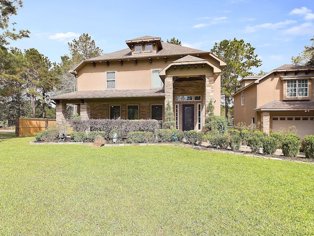 view of front of home featuring a garage and a front lawn