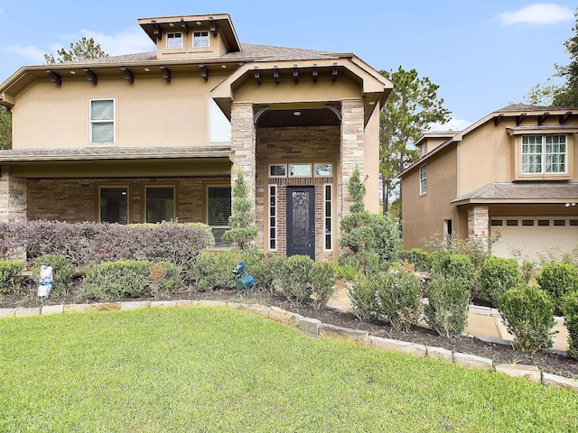 view of front facade featuring a front yard and a garage