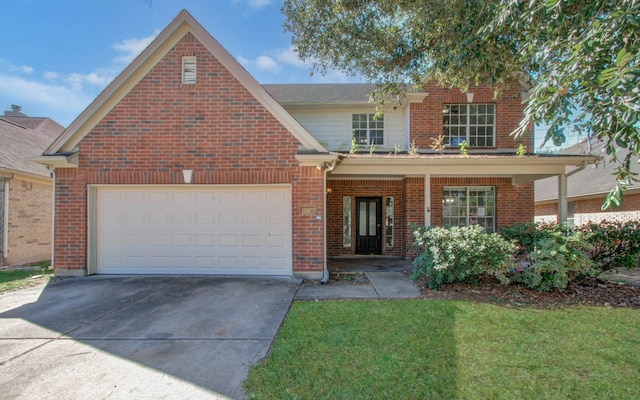 view of front property with a garage and a front lawn