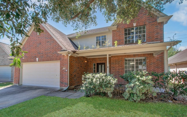 view of front of home with a garage and a front yard