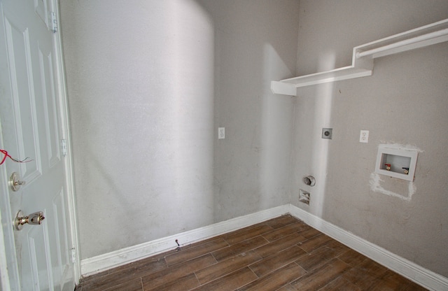 laundry room featuring hookup for a washing machine, dark hardwood / wood-style flooring, and electric dryer hookup