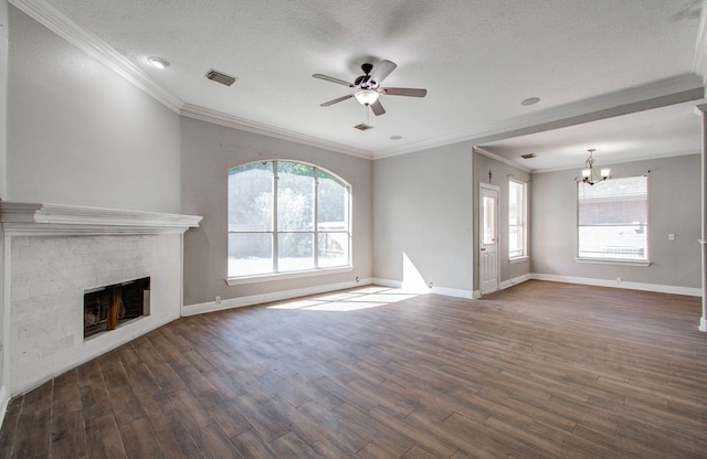 unfurnished living room featuring ceiling fan with notable chandelier, ornamental molding, and dark wood-type flooring