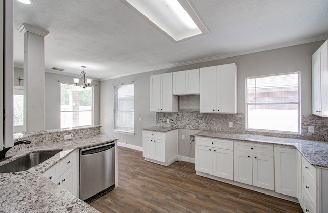 kitchen featuring dark hardwood / wood-style floors, white cabinetry, a chandelier, and stainless steel dishwasher