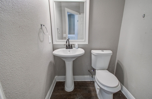 bathroom featuring sink and toilet