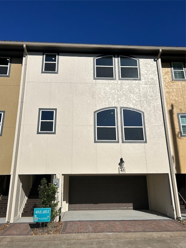 view of front of home with a garage