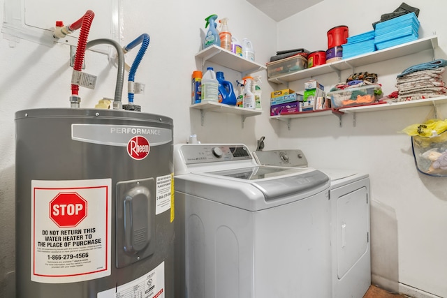 laundry room with water heater and washing machine and dryer