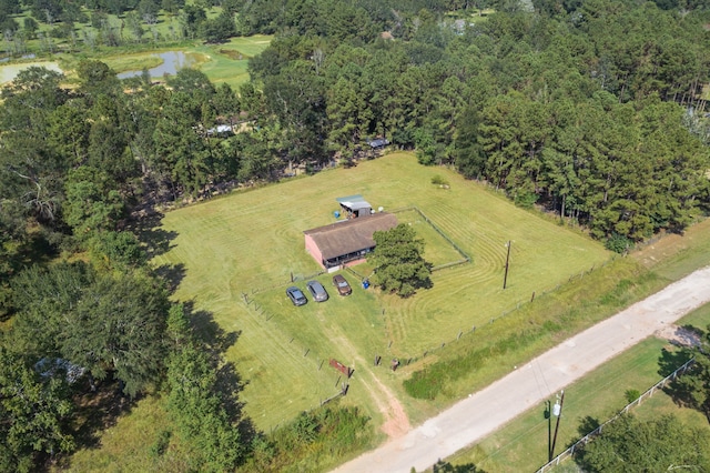 birds eye view of property featuring a water view and a rural view