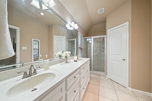 bathroom featuring vaulted ceiling, an enclosed shower, vanity, and tile patterned floors