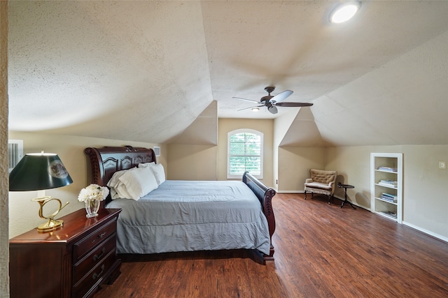 bedroom featuring vaulted ceiling, ceiling fan, dark wood-type flooring, and a textured ceiling