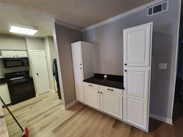 kitchen with black appliances, ornamental molding, light hardwood / wood-style flooring, and white cabinets