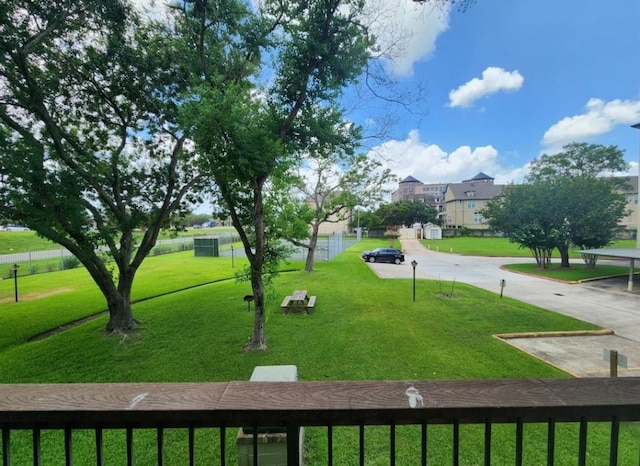 view of property's community with a yard