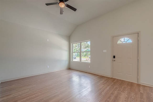 entrance foyer with ceiling fan, lofted ceiling, plenty of natural light, and light hardwood / wood-style floors