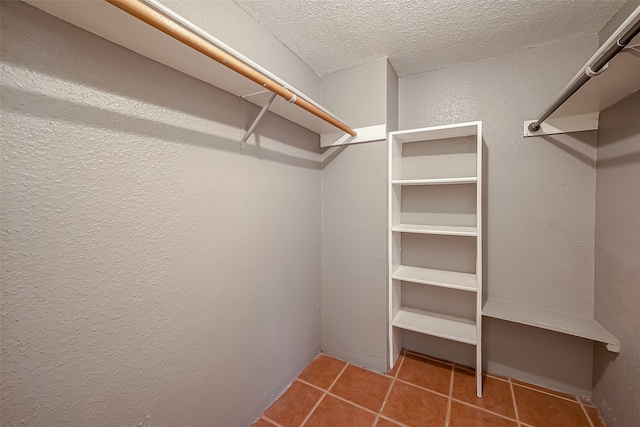 spacious closet featuring tile patterned floors