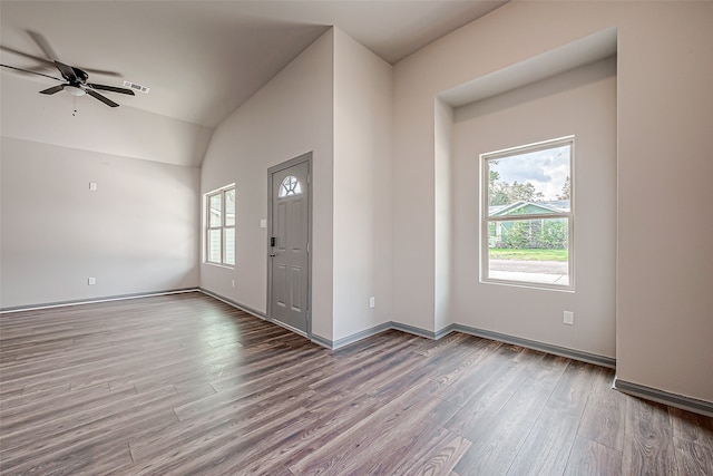 entrance foyer featuring vaulted ceiling, ceiling fan, and hardwood / wood-style floors