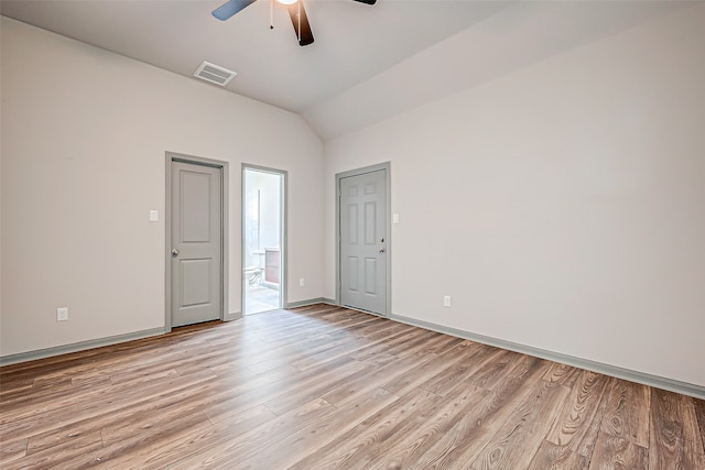 unfurnished room featuring lofted ceiling, light hardwood / wood-style floors, and ceiling fan