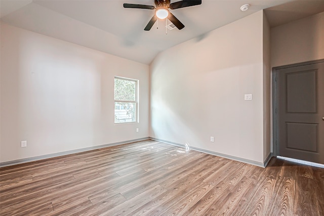 unfurnished room with wood-type flooring, vaulted ceiling, and ceiling fan