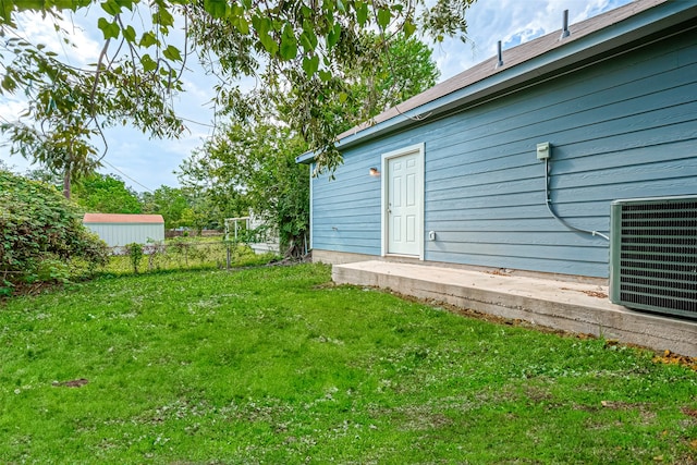 view of yard with central AC