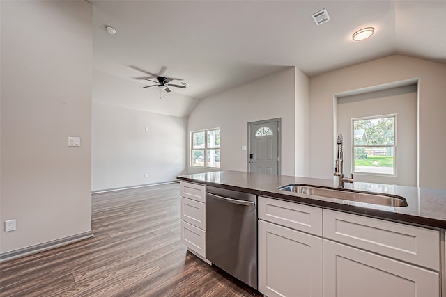 kitchen with sink, white cabinets, vaulted ceiling, ceiling fan, and stainless steel dishwasher