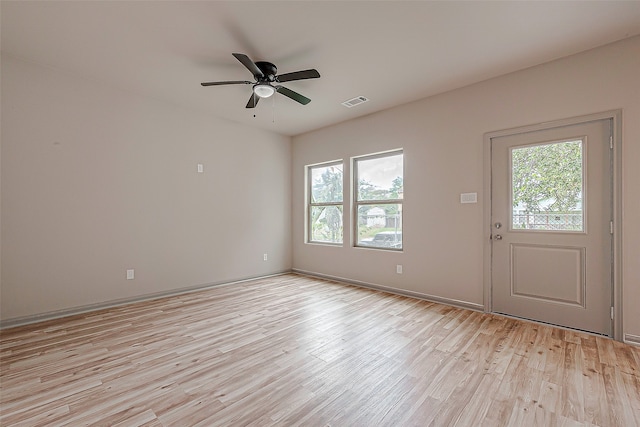 interior space featuring ceiling fan, light wood-type flooring, and plenty of natural light