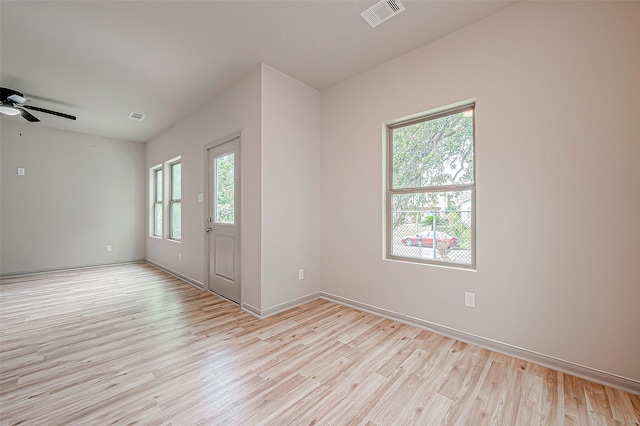 foyer entrance featuring light hardwood / wood-style floors, ceiling fan, and a wealth of natural light