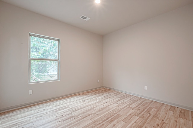 unfurnished room with light hardwood / wood-style flooring