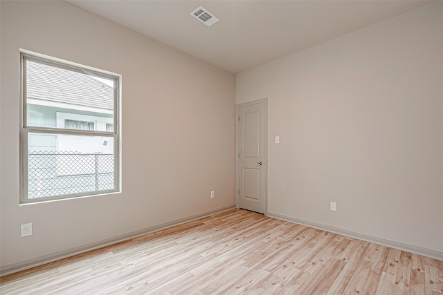 spare room with light hardwood / wood-style floors