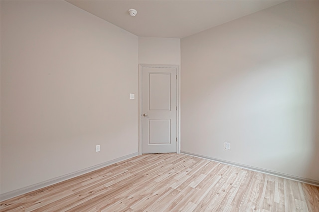 unfurnished room with light hardwood / wood-style floors