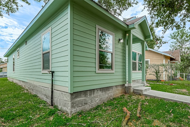 view of property exterior featuring a yard