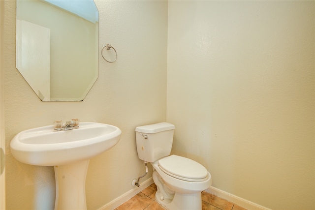 bathroom with tile patterned flooring and toilet