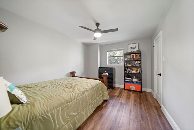 bedroom with hardwood / wood-style floors and ceiling fan