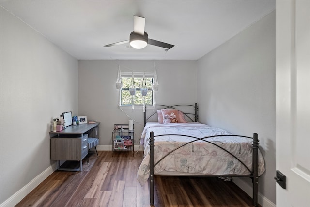 bedroom featuring dark hardwood / wood-style flooring and ceiling fan