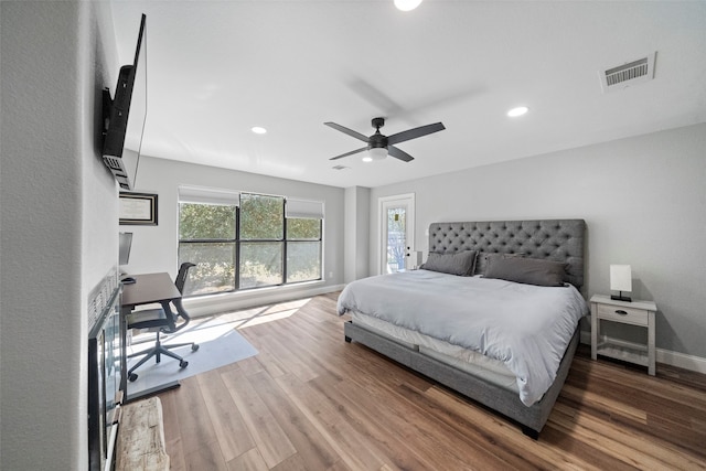 bedroom featuring hardwood / wood-style floors and ceiling fan