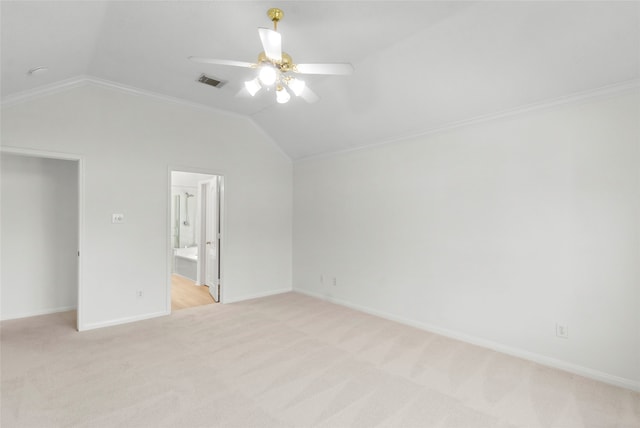 unfurnished bedroom with visible vents, vaulted ceiling, light carpet, and baseboards