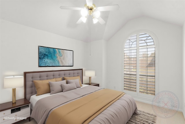 bedroom featuring a ceiling fan, carpet flooring, and vaulted ceiling