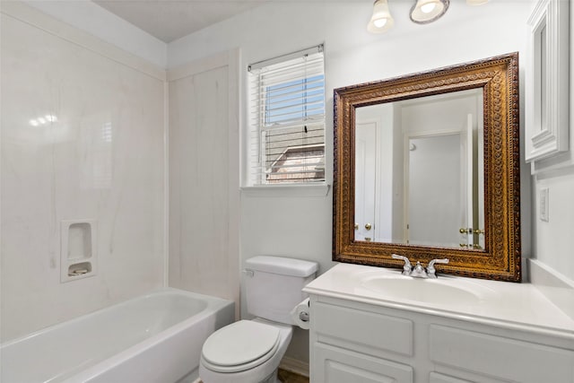 bathroom with toilet, bathtub / shower combination, and vanity