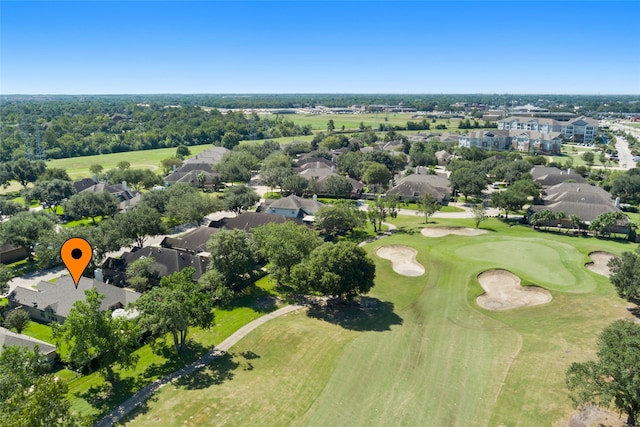 aerial view with view of golf course and a residential view