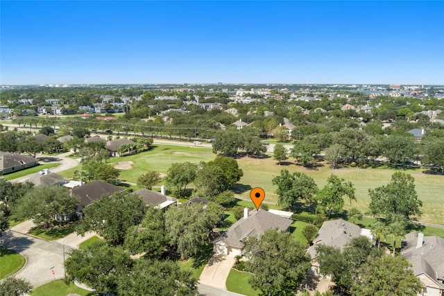 birds eye view of property featuring view of golf course and a residential view