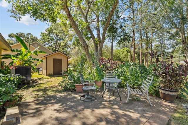 view of patio with a storage shed and central AC