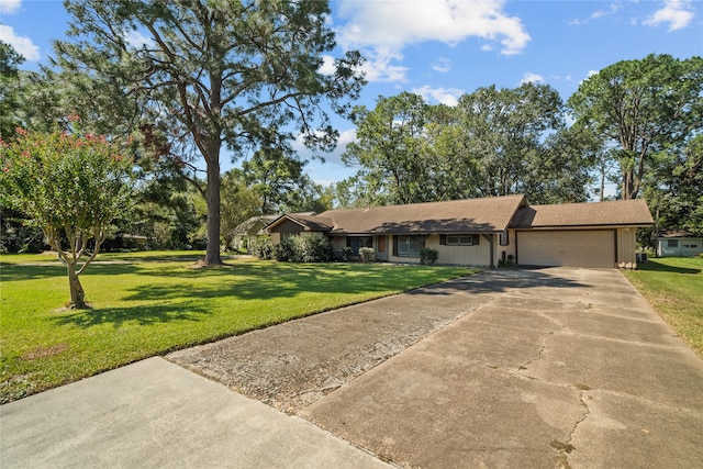 ranch-style home with a garage and a front yard