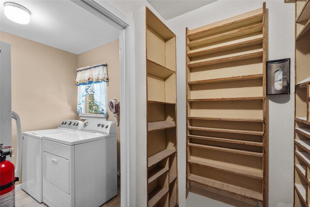 laundry room with washing machine and clothes dryer