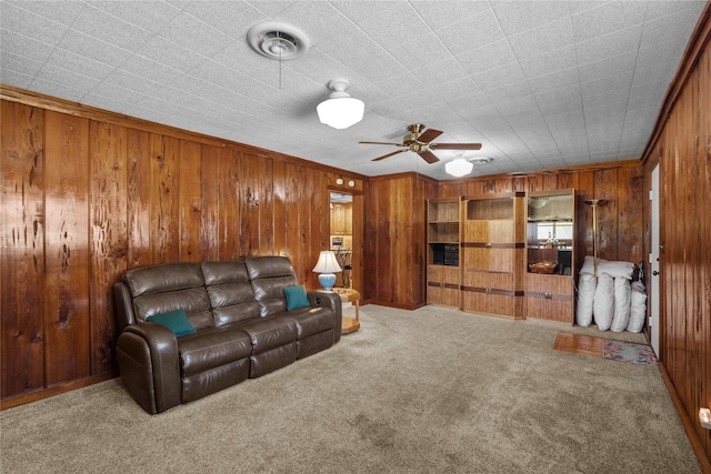 living room featuring carpet floors and wooden walls