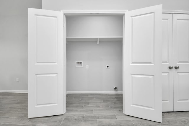 laundry room with washer hookup, electric dryer hookup, and light wood-type flooring