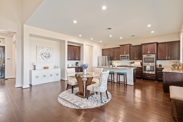 dining area with dark wood-type flooring