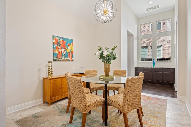 dining space featuring a chandelier and light hardwood / wood-style floors