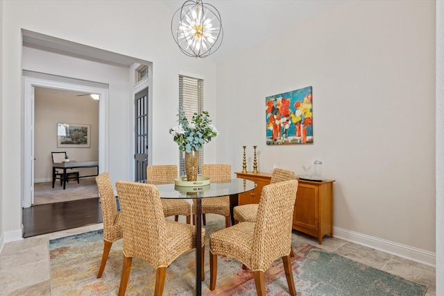 dining space featuring a chandelier and light hardwood / wood-style flooring