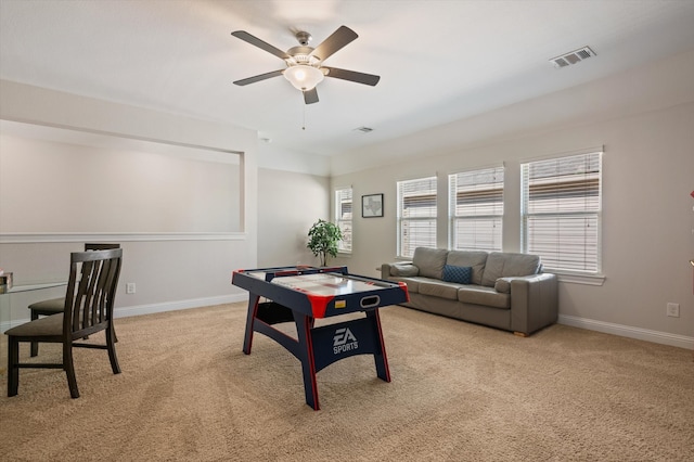 playroom featuring ceiling fan and light colored carpet