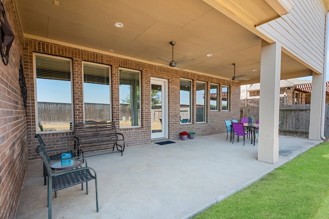 view of patio featuring ceiling fan